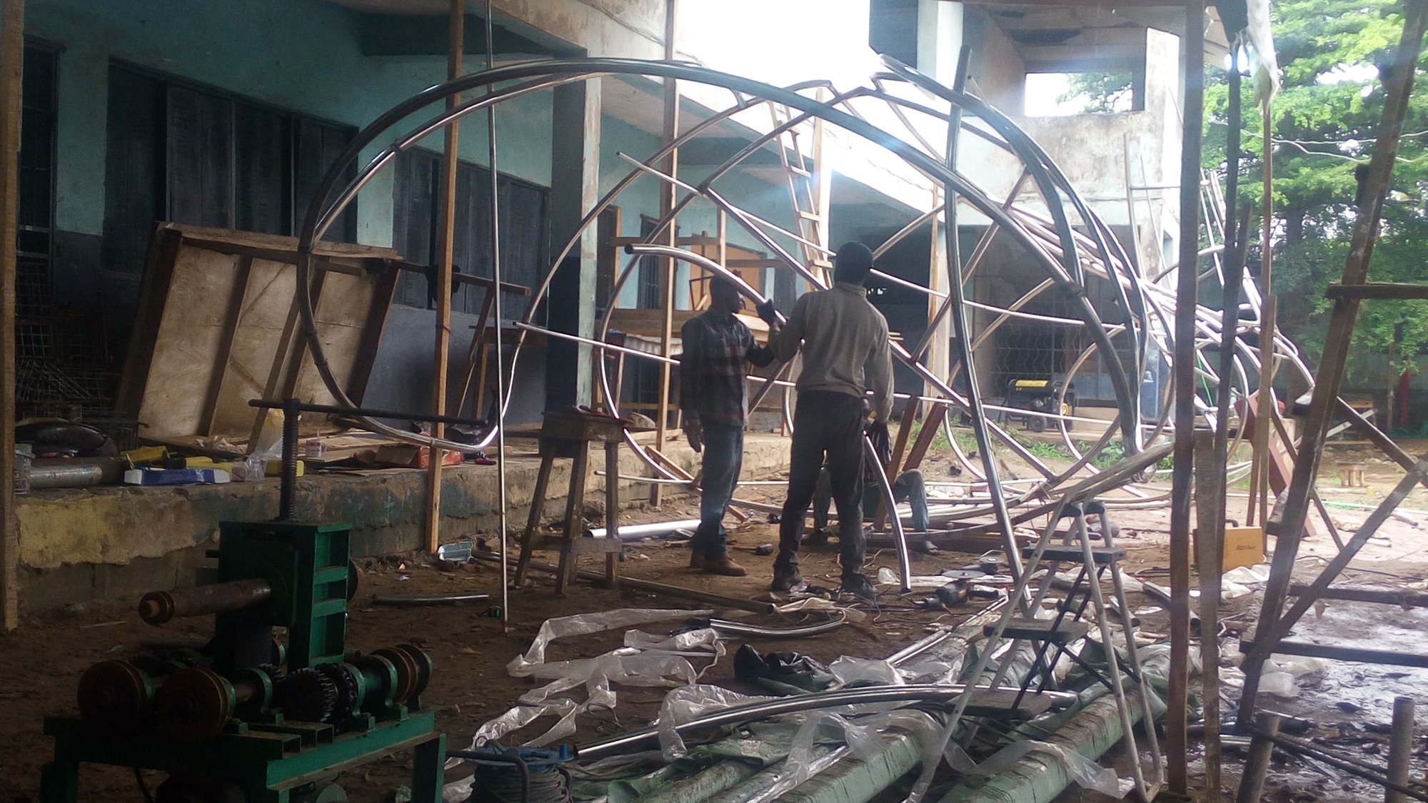 Eja Nla: the steel skeleton taking shape in the warehouse.